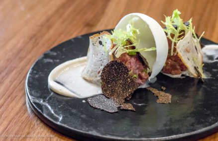 Wagyu beef tartare with a liquid nitrogen-frozen burrata cheese dome and truffle